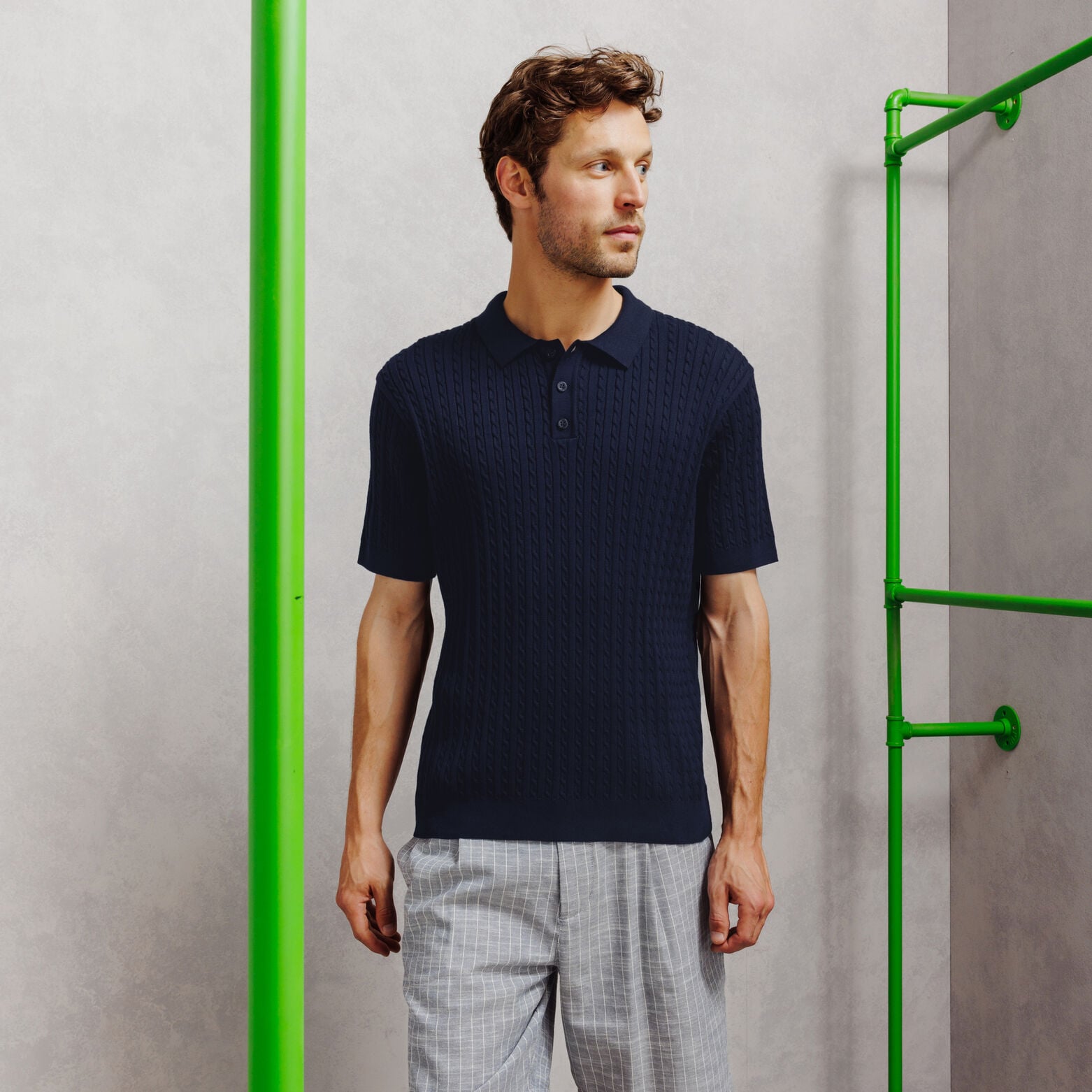 Gebreide polo met korte mouwen en kabelmotief