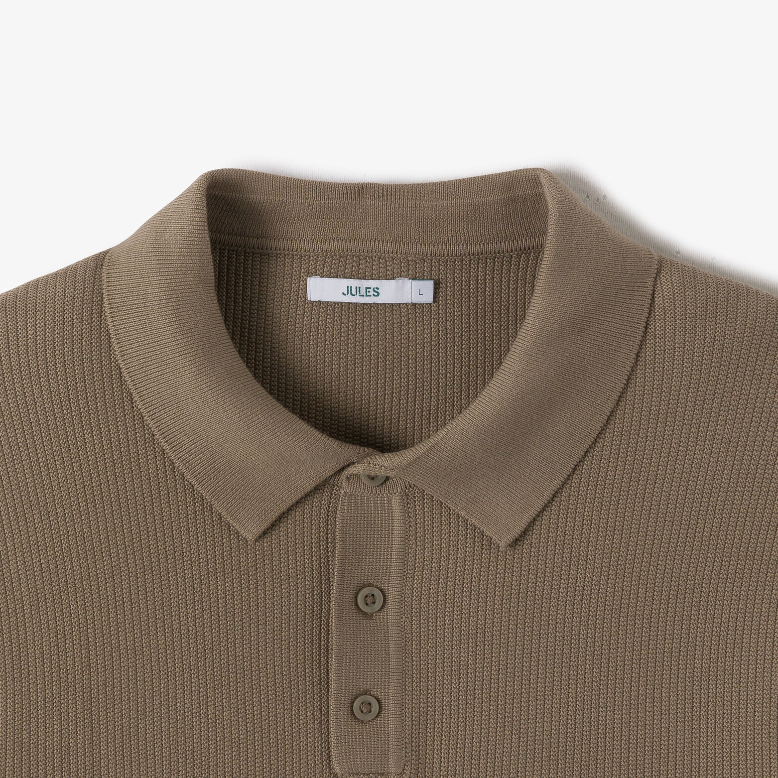 Polo in tricot met fantasie stekenpatroon en knoop