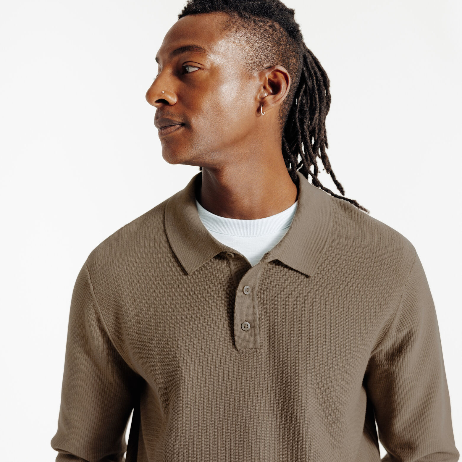 Polo in tricot met fantasie stekenpatroon en knoop