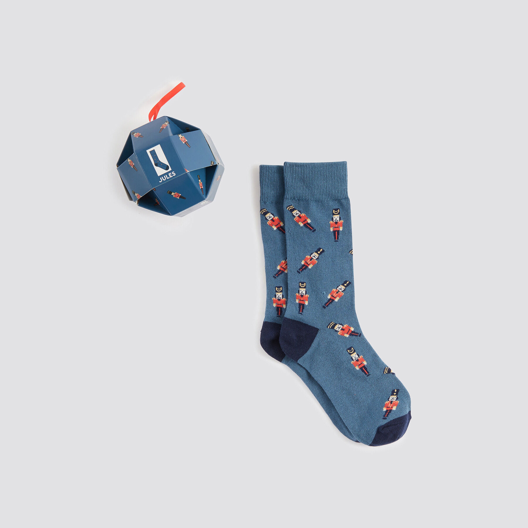 Chaussettes fantaisie dans une boule de Noel