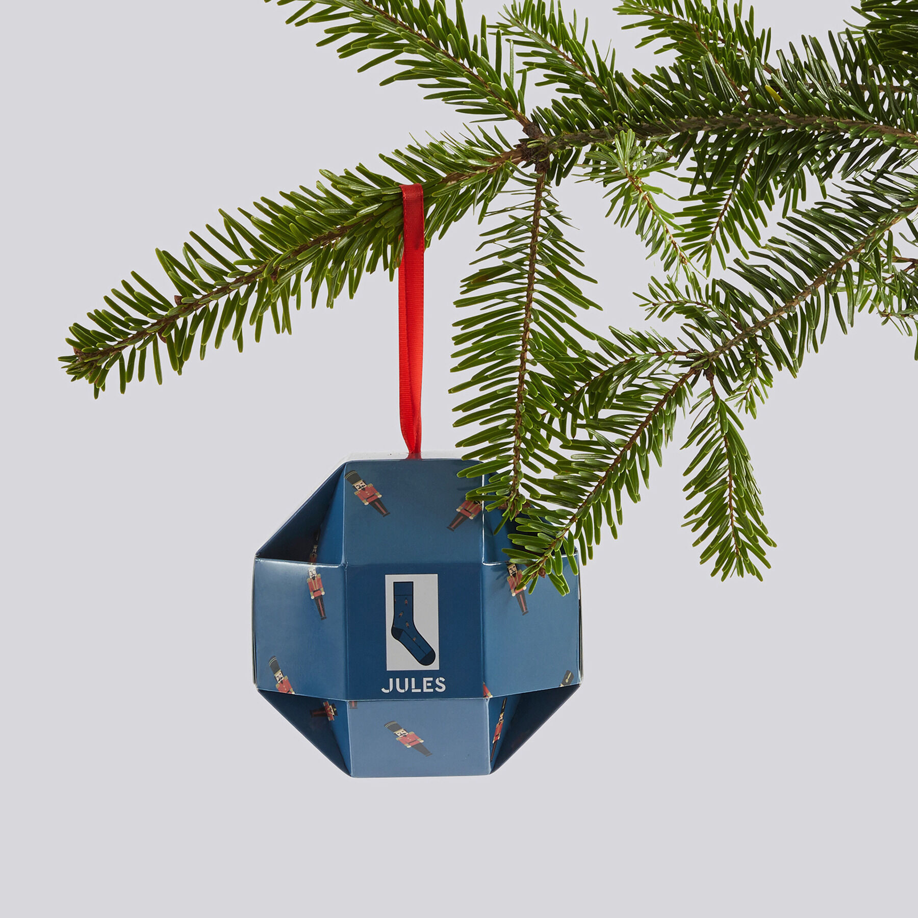 Chaussettes fantaisie dans une boule de Noel