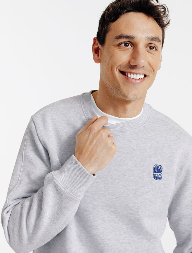 Gem&ecirc;leerde sweater ronde hals, borduursel borst