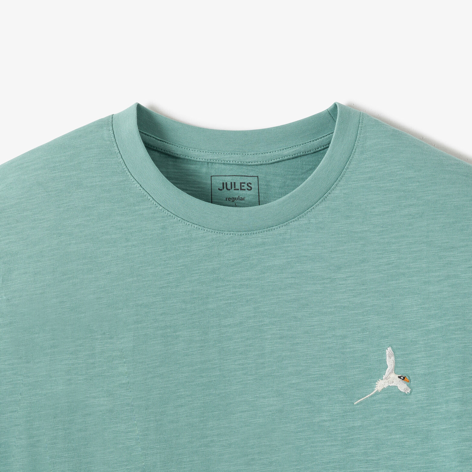 T-shirt in gevlamde stof met borduursel op de bors