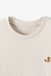 T-shirt in gevlamde stof met borduursel op de bors