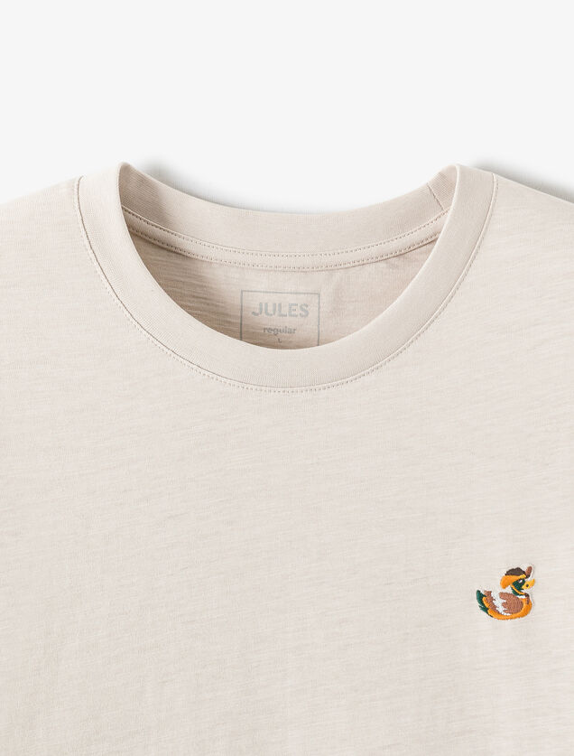 T-shirt in gevlamde stof met borduursel op de bors