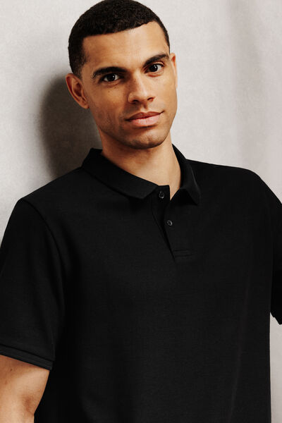 Effen polo in piqu&eacute;katoen met korte mouwen