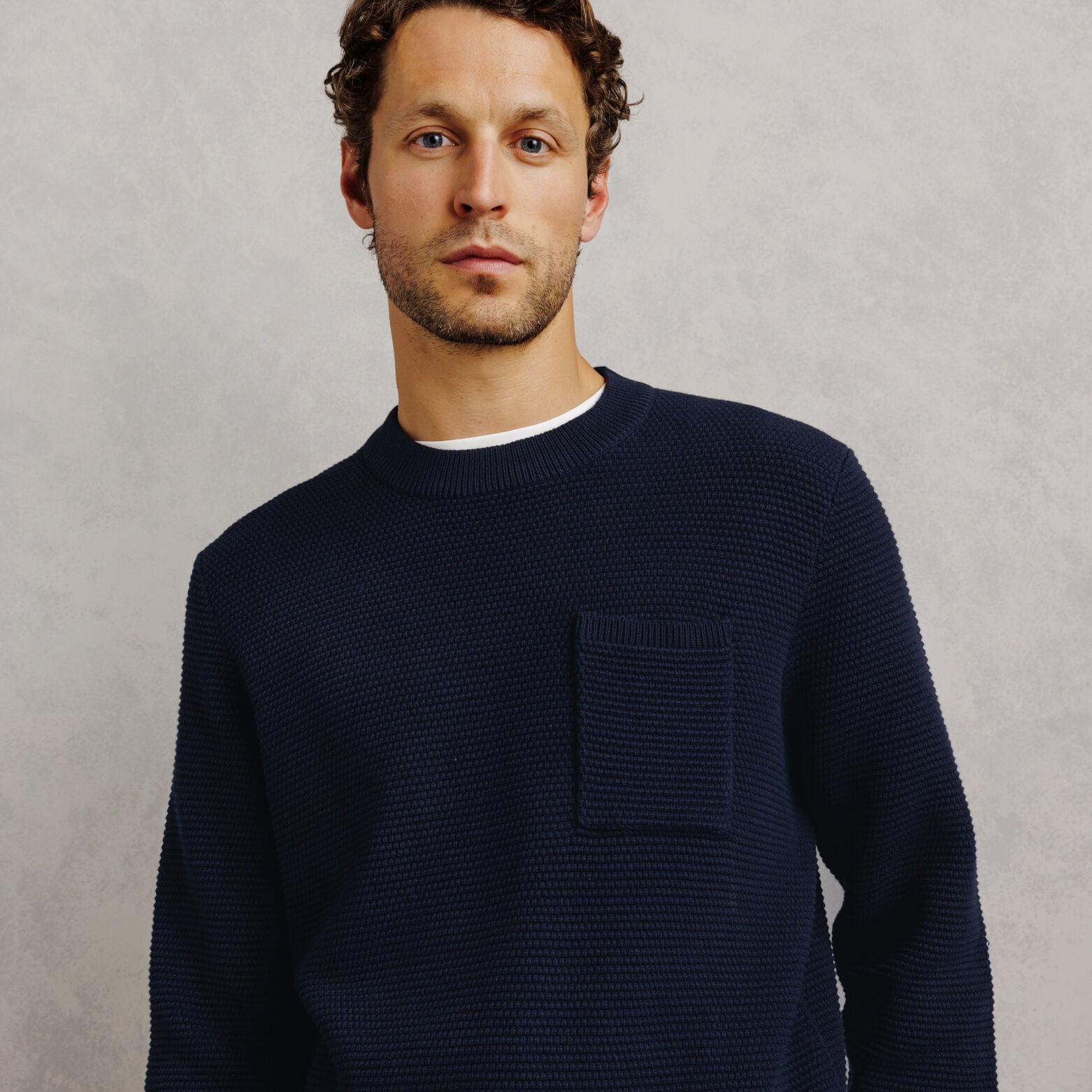 Pull col rond point de riz poche poitrine