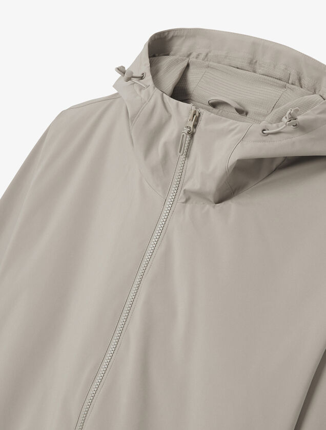 Blouson coupe-vent à capuche