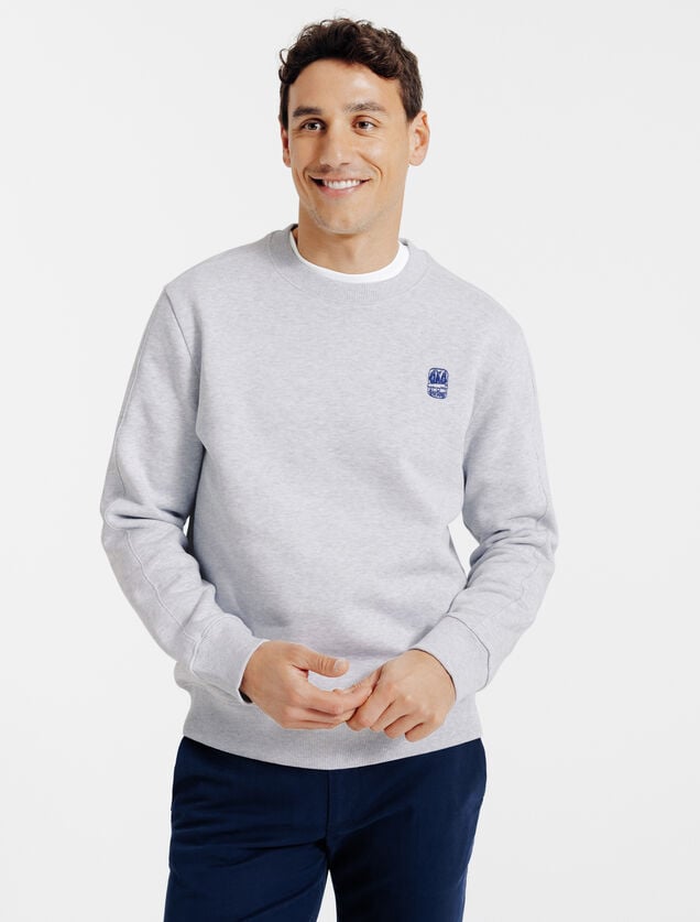 Gem&ecirc;leerde sweater ronde hals, borduursel borst