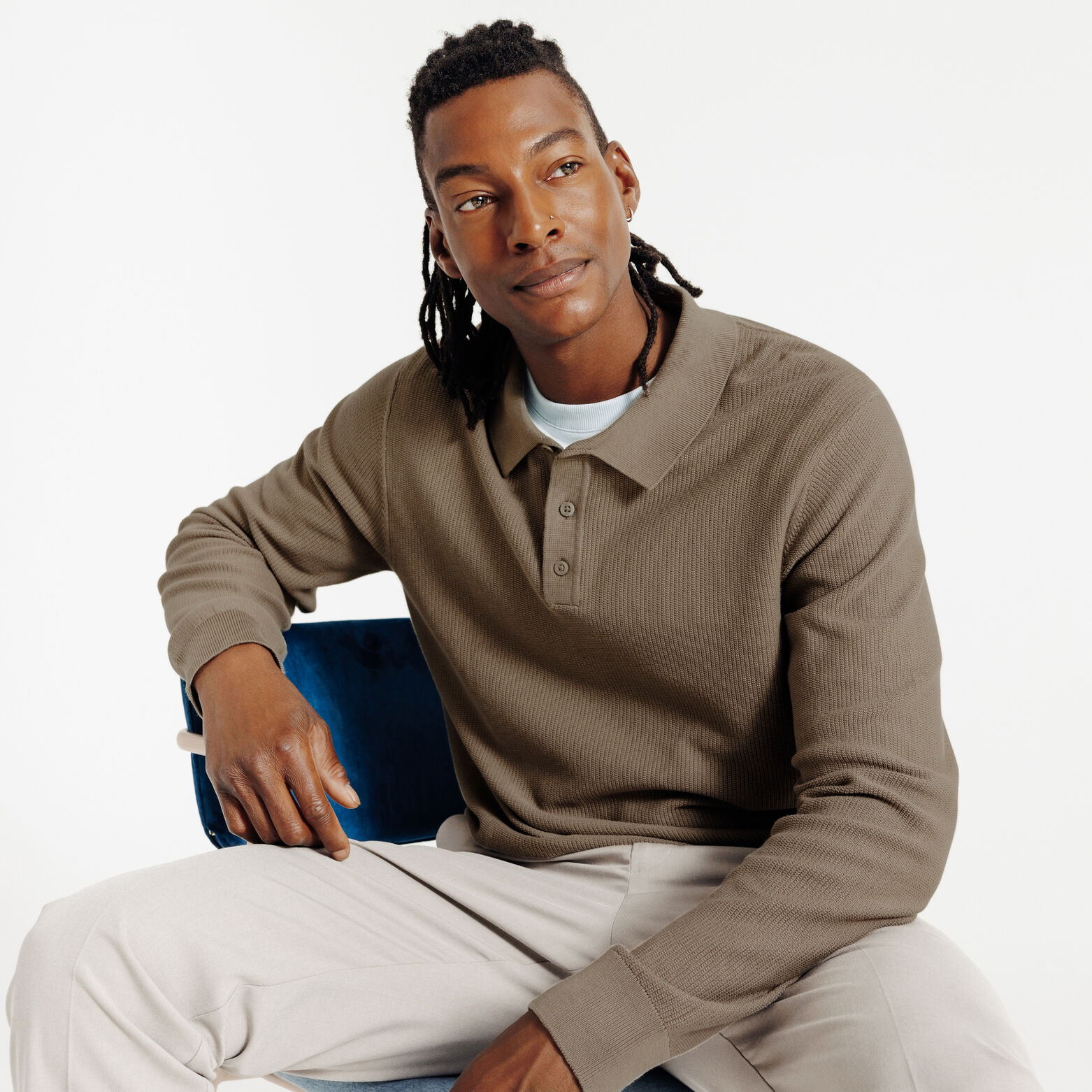 Polo in tricot met fantasie stekenpatroon en knoop