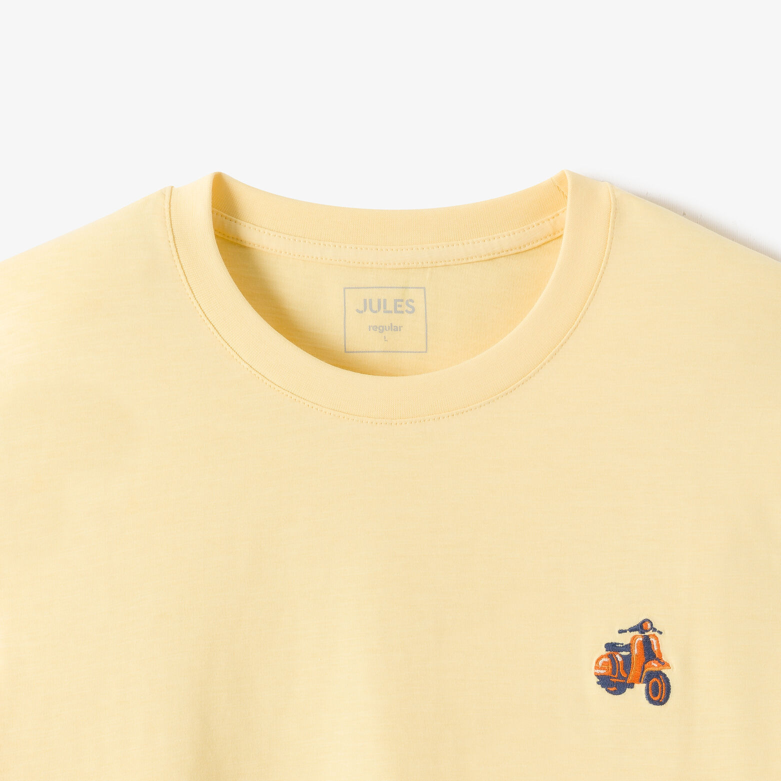 T-shirt in gevlamde stof met borduursel op de bors