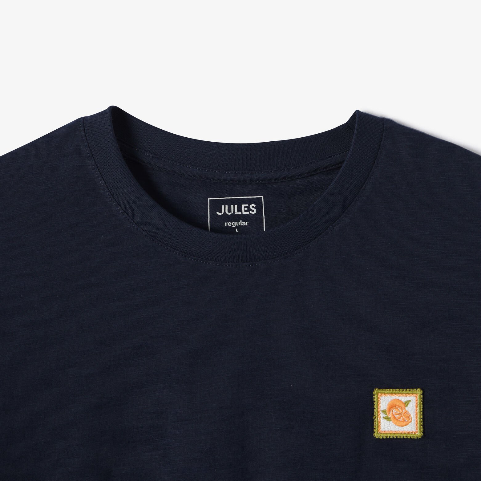 T-shirt in gevlamde stof met borduursel op de bors