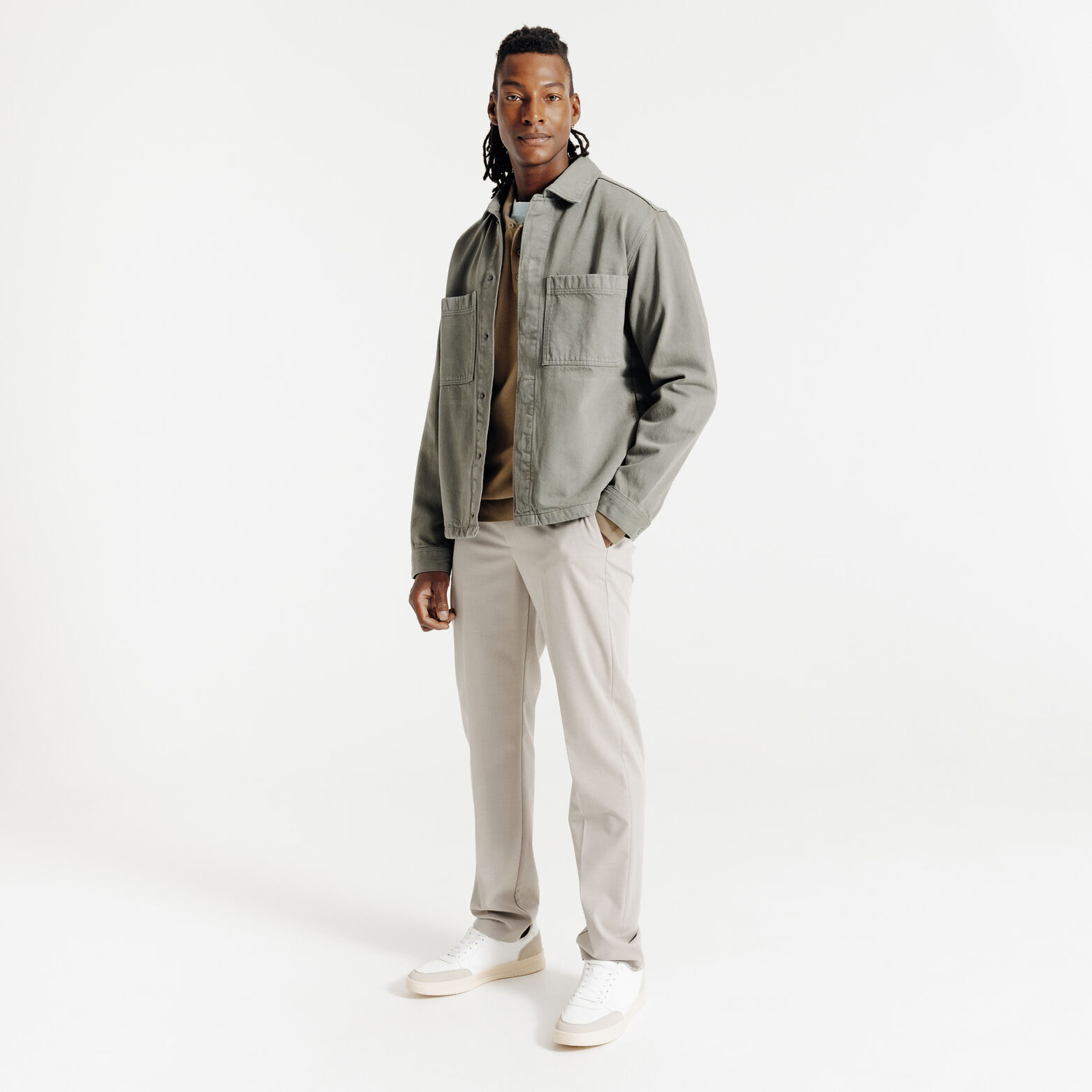 Polo in tricot met fantasie stekenpatroon en knoop